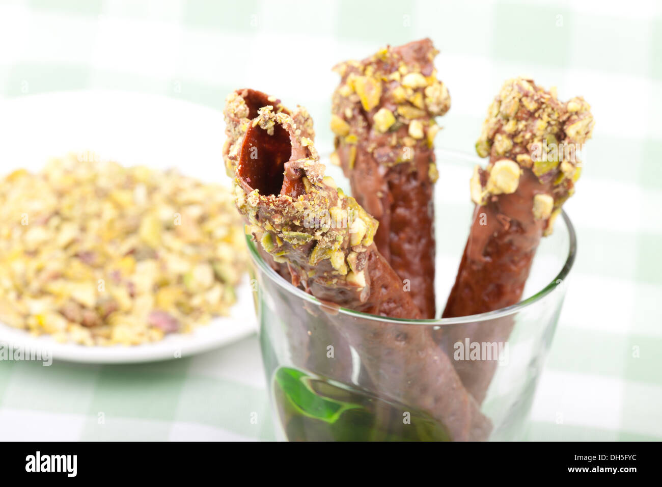 brandy snaps with pistachios in the glass Stock Photo