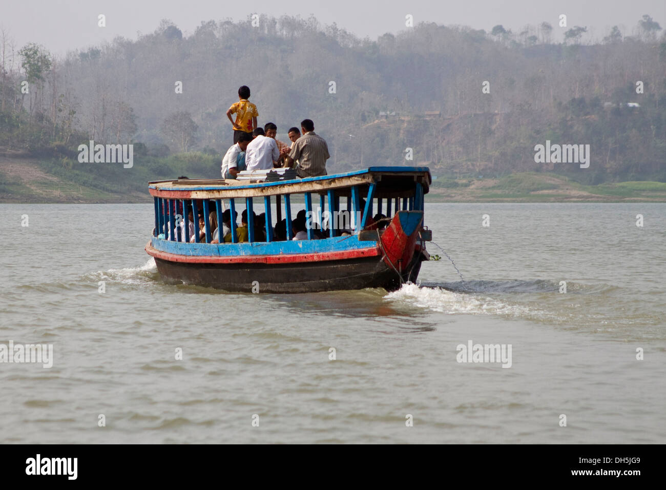 Group of people on the roof of a ferry boat, Kaptai Lake, Rangamati, Chittagong Hill Tracts, Bangladesh, South Asia, Asia Stock Photo