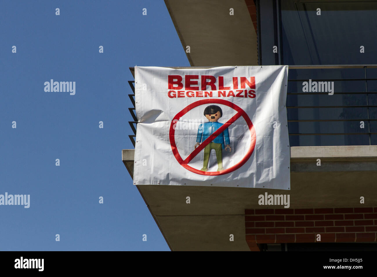 Banner "Berlin gegen Nazis", German for "Berlin against Nazis", with  crossed-out Hitler-Playmobil figure, Berlin Stock Photo - Alamy