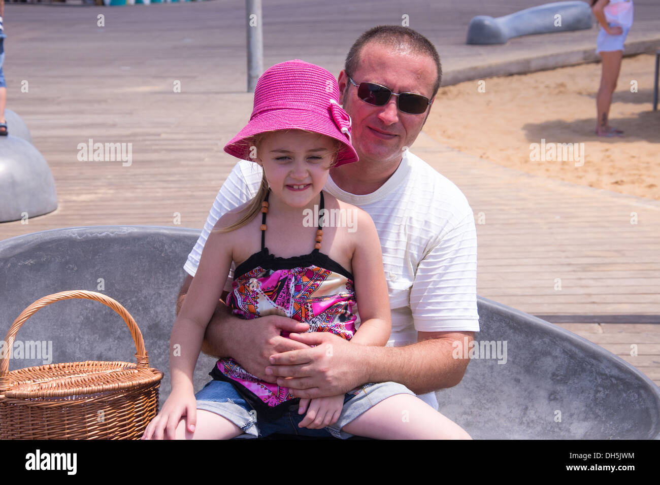 Father and Daughter at the beach on sunlight day Stock Photo