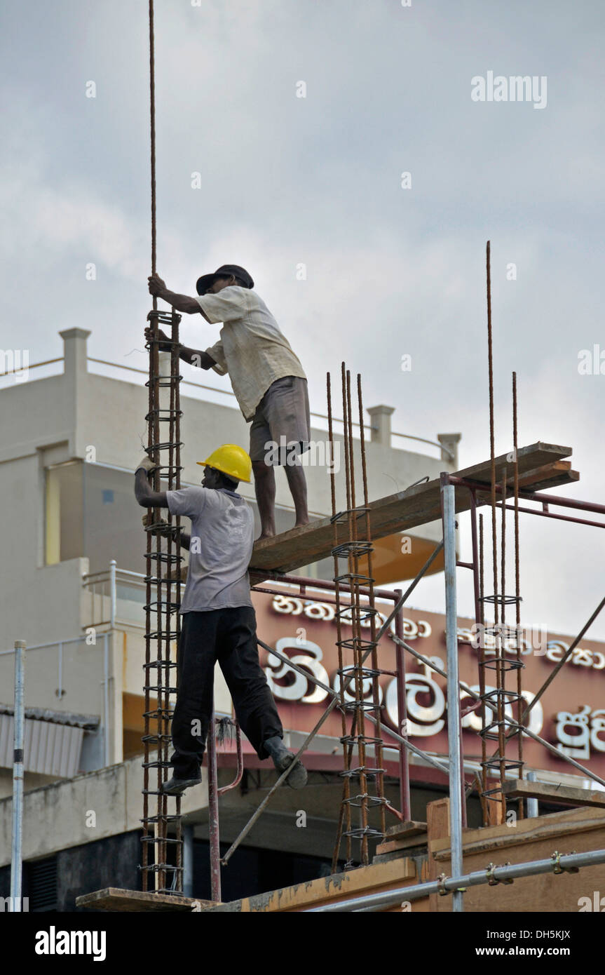 Construction site of the new bus station, steel fixers, builders, Galle, Sri Lanka, Ceylon, South Asia, Asia Stock Photo