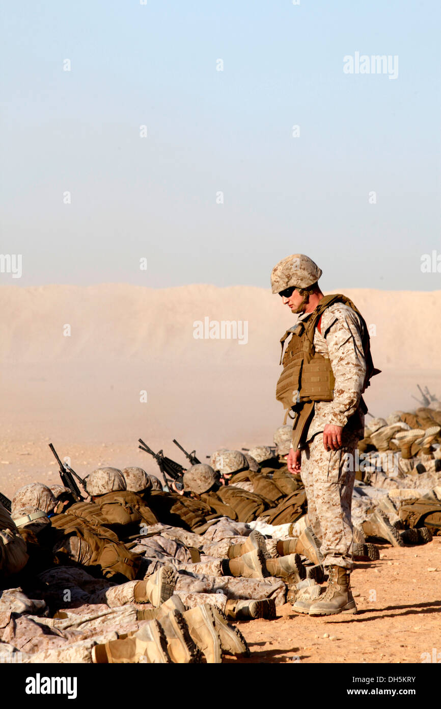 U.S. Marine Corps Lt. Col. Christian Ward, a group 3 deputy with 2nd Marine Aircraft Wing (Forward), supervises Marines during a Battle Sight Zero (BZO) range at Camp Leatherneck, Helmand province, Afghanistan, Oct. 25, 2013. A BZO was performed to mainta Stock Photo