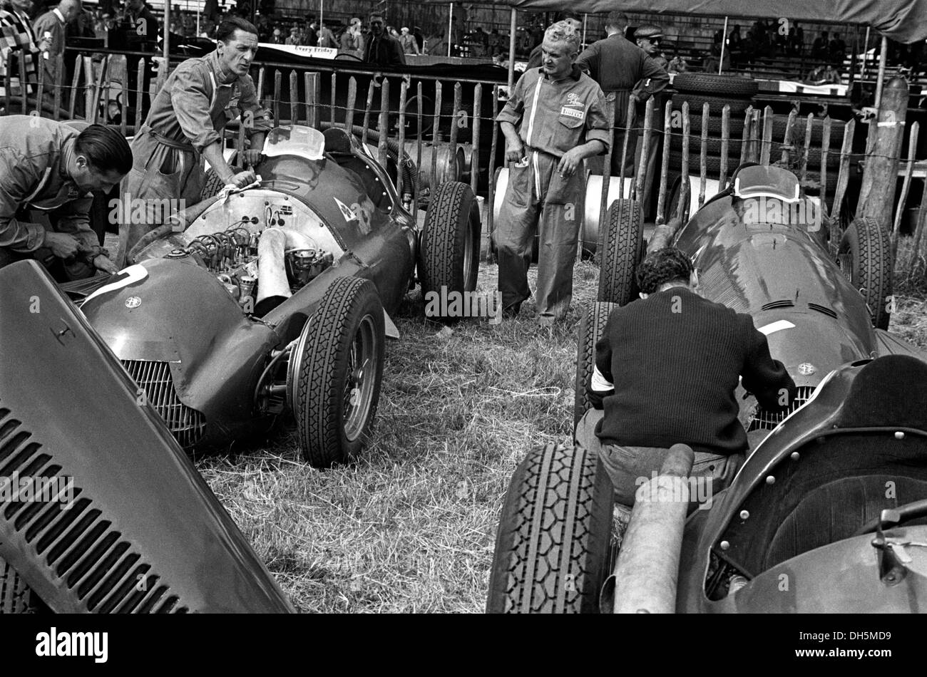 Alfa Romeo 158s being preprared by the team mechanics in the paddock at Silverstone, England 1951. Stock Photo