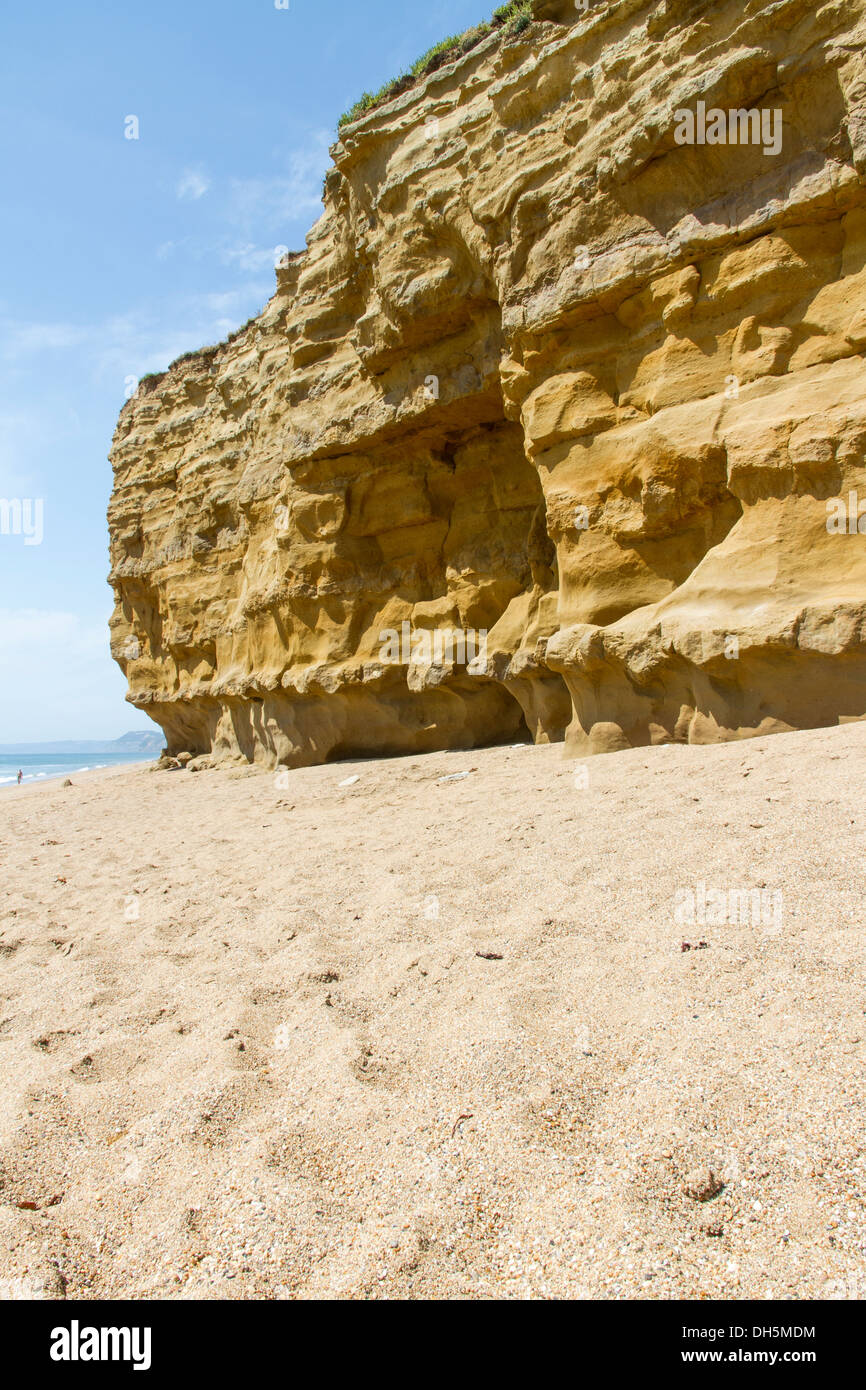 Sandstone Cliffs with pebbled beach. Hive Beach, Burton Bradstock, Bridport, Dorset, England, United Kingdom. Stock Photo