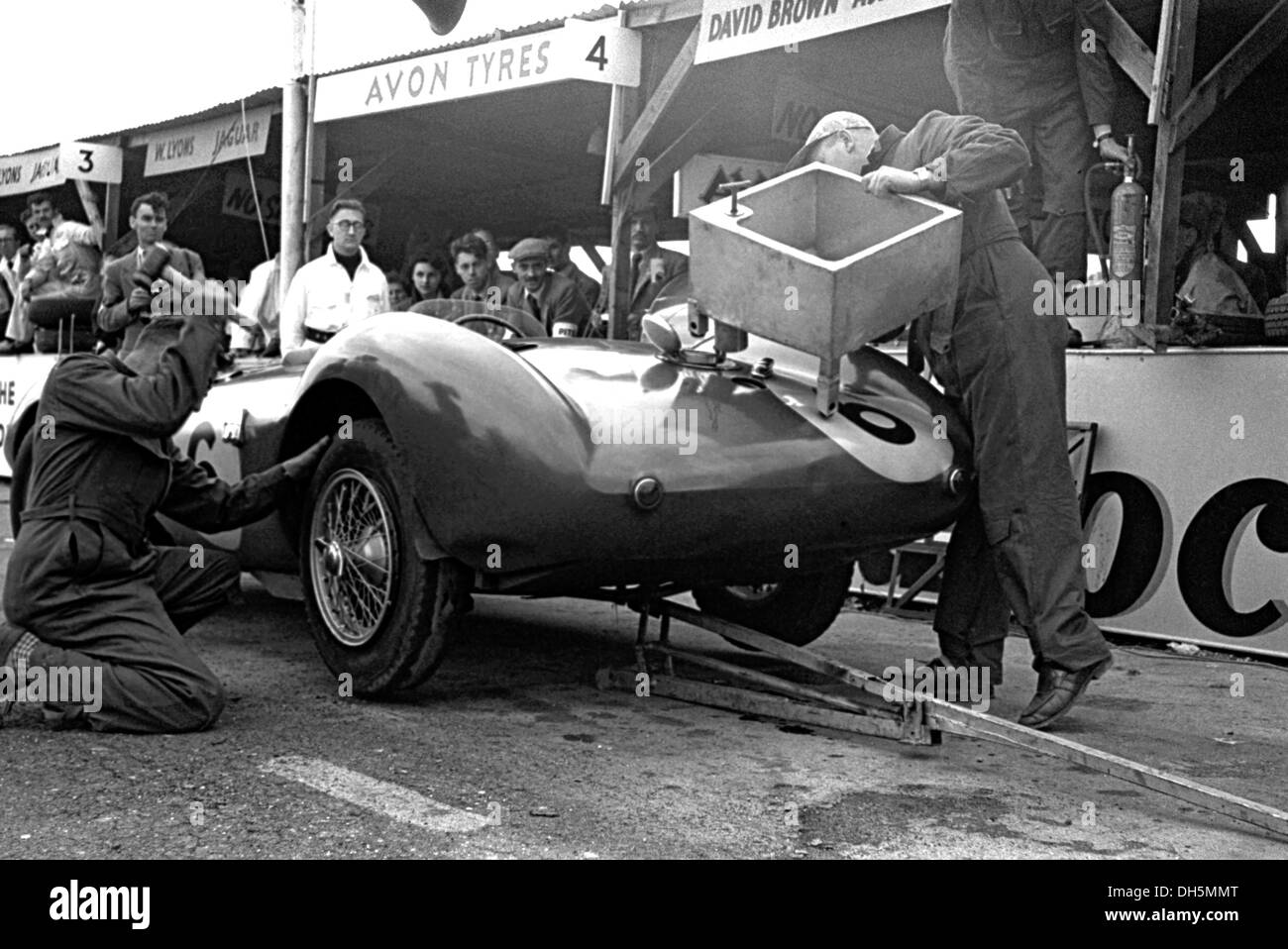 Pat Griffiths and Peter Collins Aston Martin DB3S, one of the David Brown works team cars in the pits at Goodwood, England 1953. Stock Photo