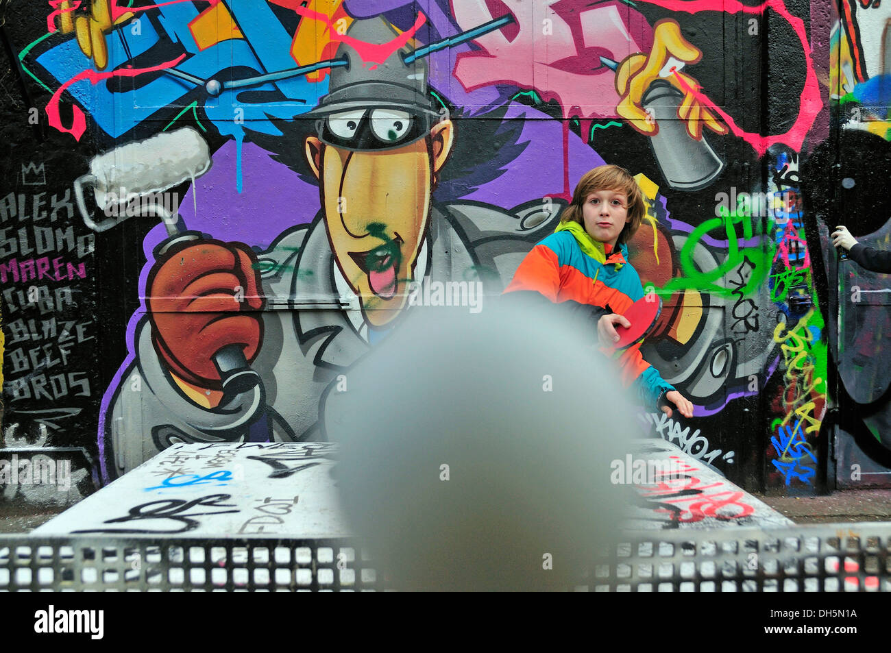 A twelveyearold boy playing table tennis, football area, Cologne
