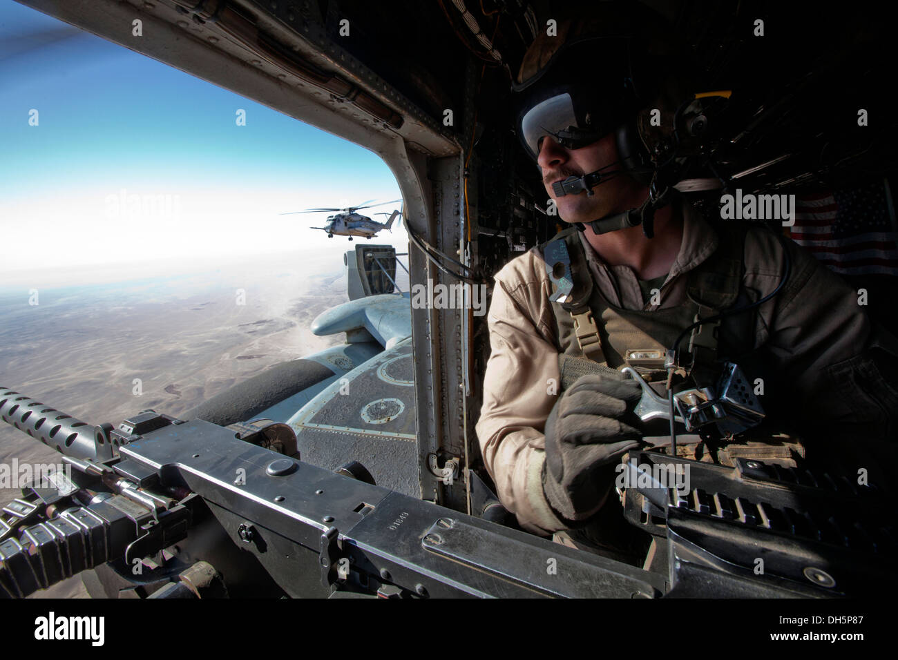 U.S. Marine Corps Lance Cpl. Andrew J. Savoie, a crew chief with Marine Heavy Helicopter Squadron 462 (HMH-462) provides aerial Stock Photo