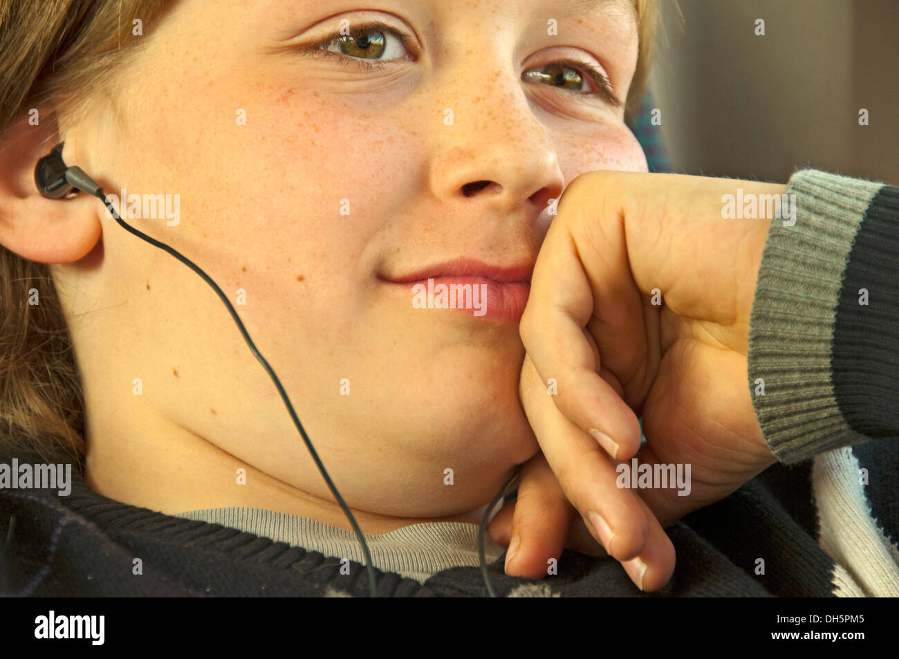 Boy, 11 years, with headphones, Germany Stock Photo