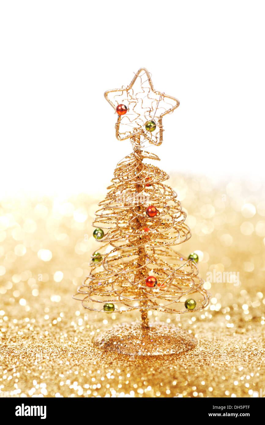 Golden christmas fir tree decoration on glitter background with white ...