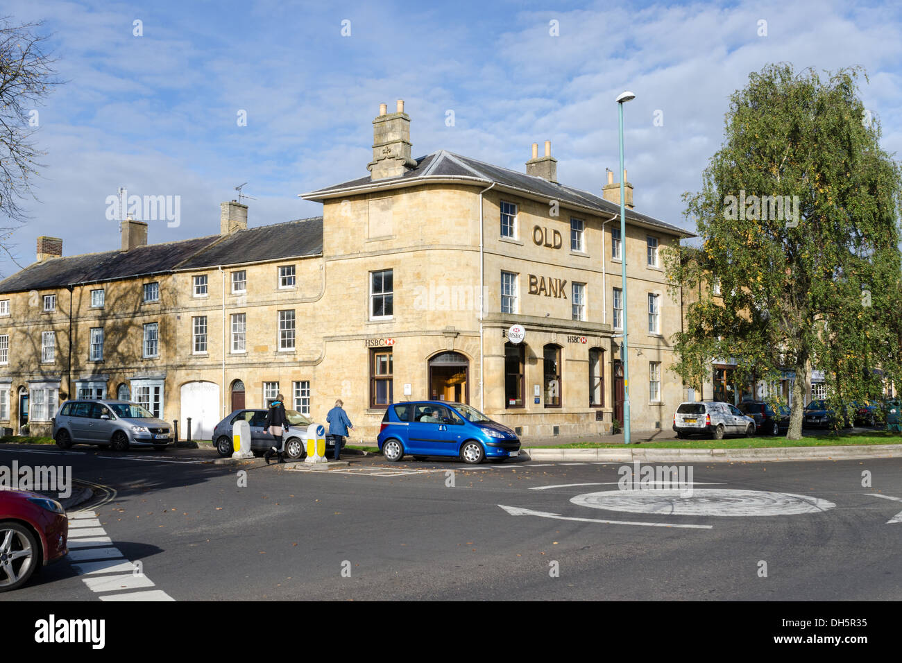 Cotswold yellow stone building known as the Old Bank in Moretonin