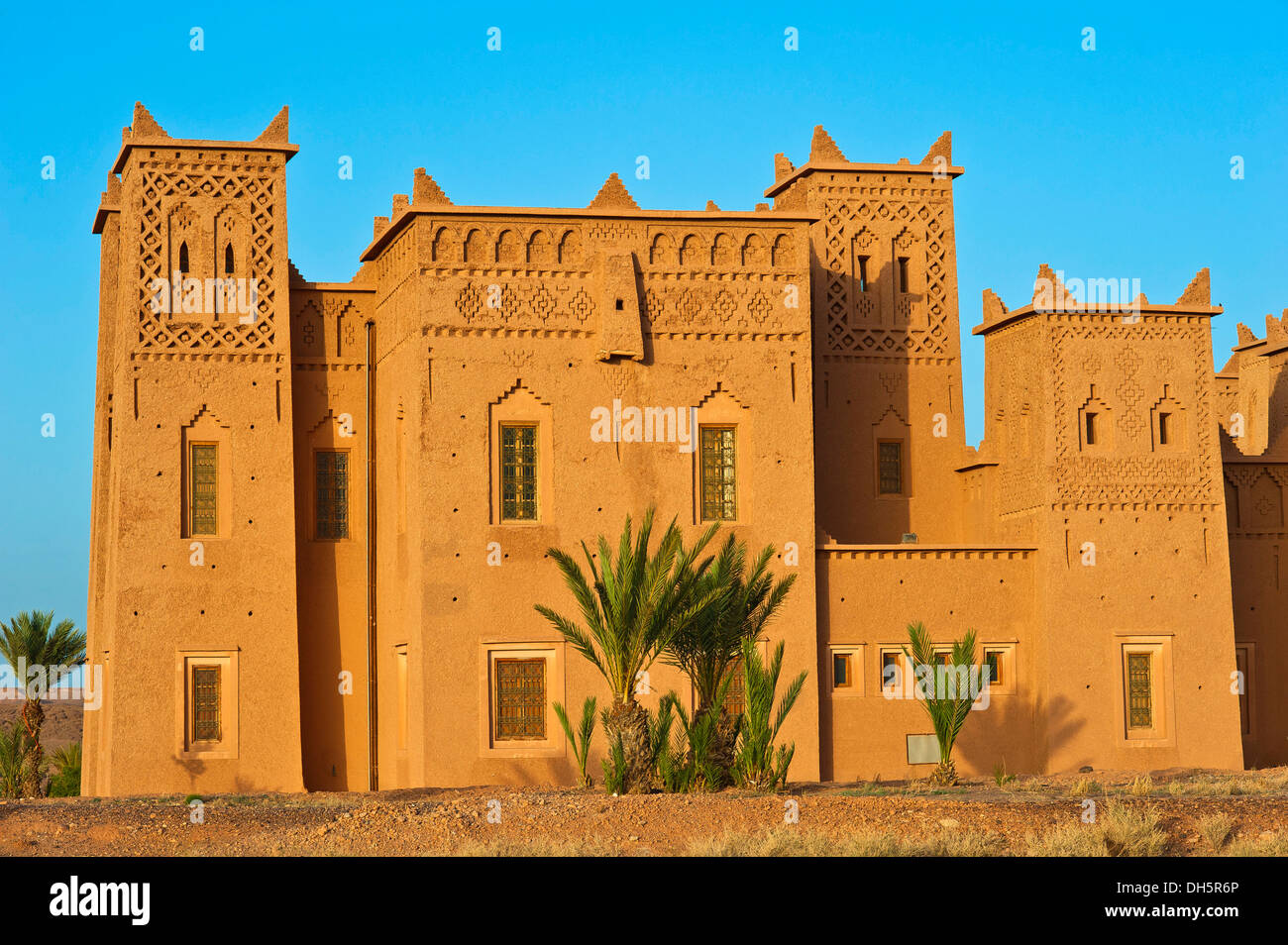 Tower of a kasbah with many ornamental decorations, mud brick fortress of the Berber people, Tighremt, Ouarzazate Stock Photo
