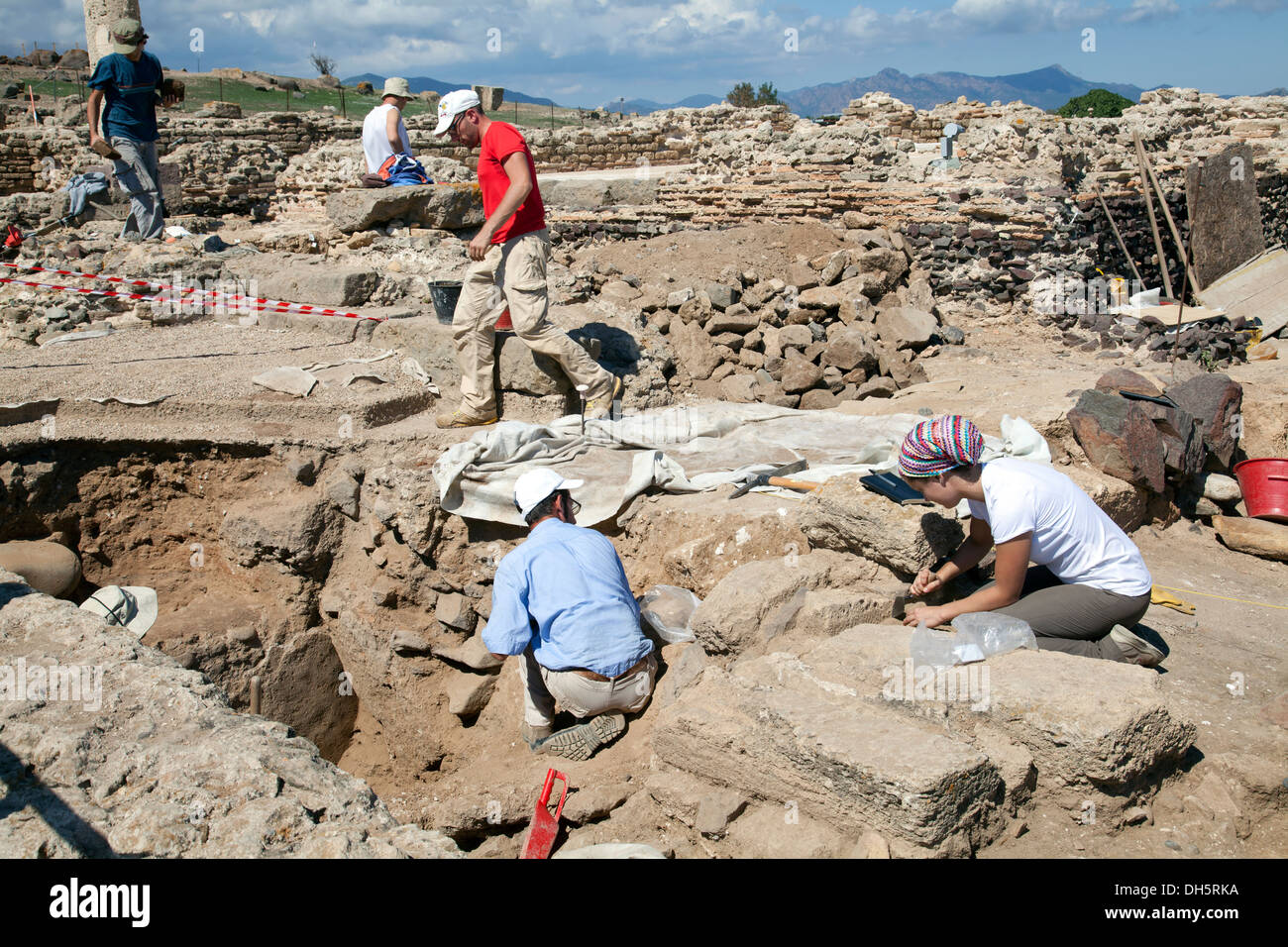 Archaeologists on Site Digging at Nora Ruins in Southern Sardinia Stock Photo
