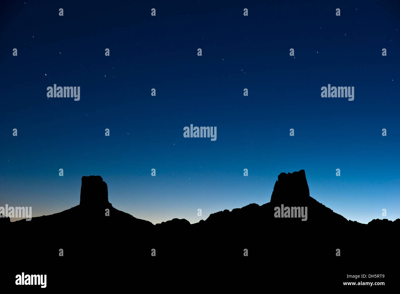 Starry sky above the imposing stone rock formations named Madame and Monsieur, Bab'n Ali, Jebel Sarhro or Little Atlas mountain Stock Photo