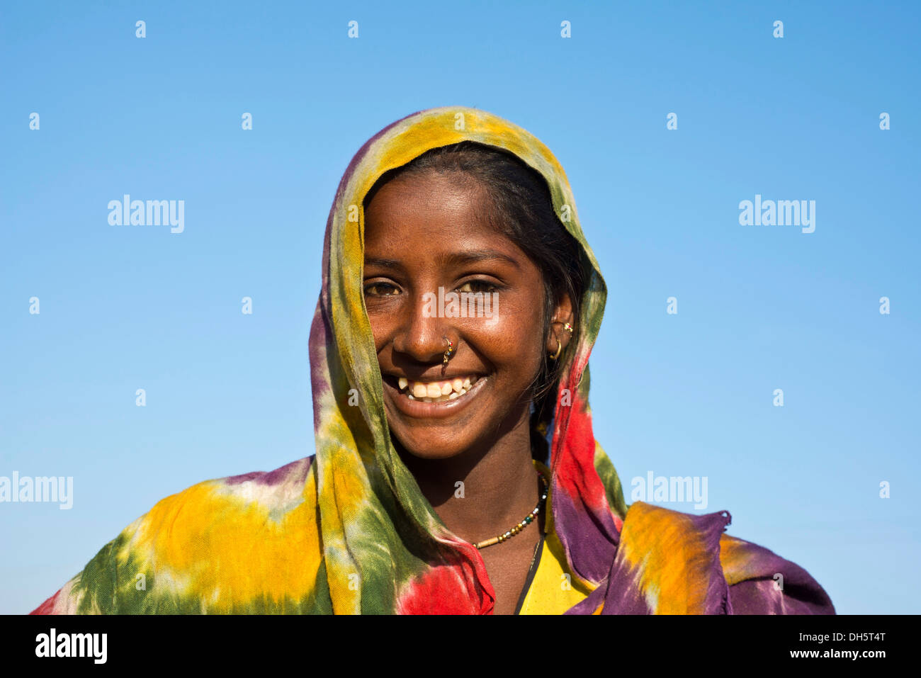 Young Indian woman with colourful scarf, portrait, Pushkar, Rajasthan, India Stock Photo