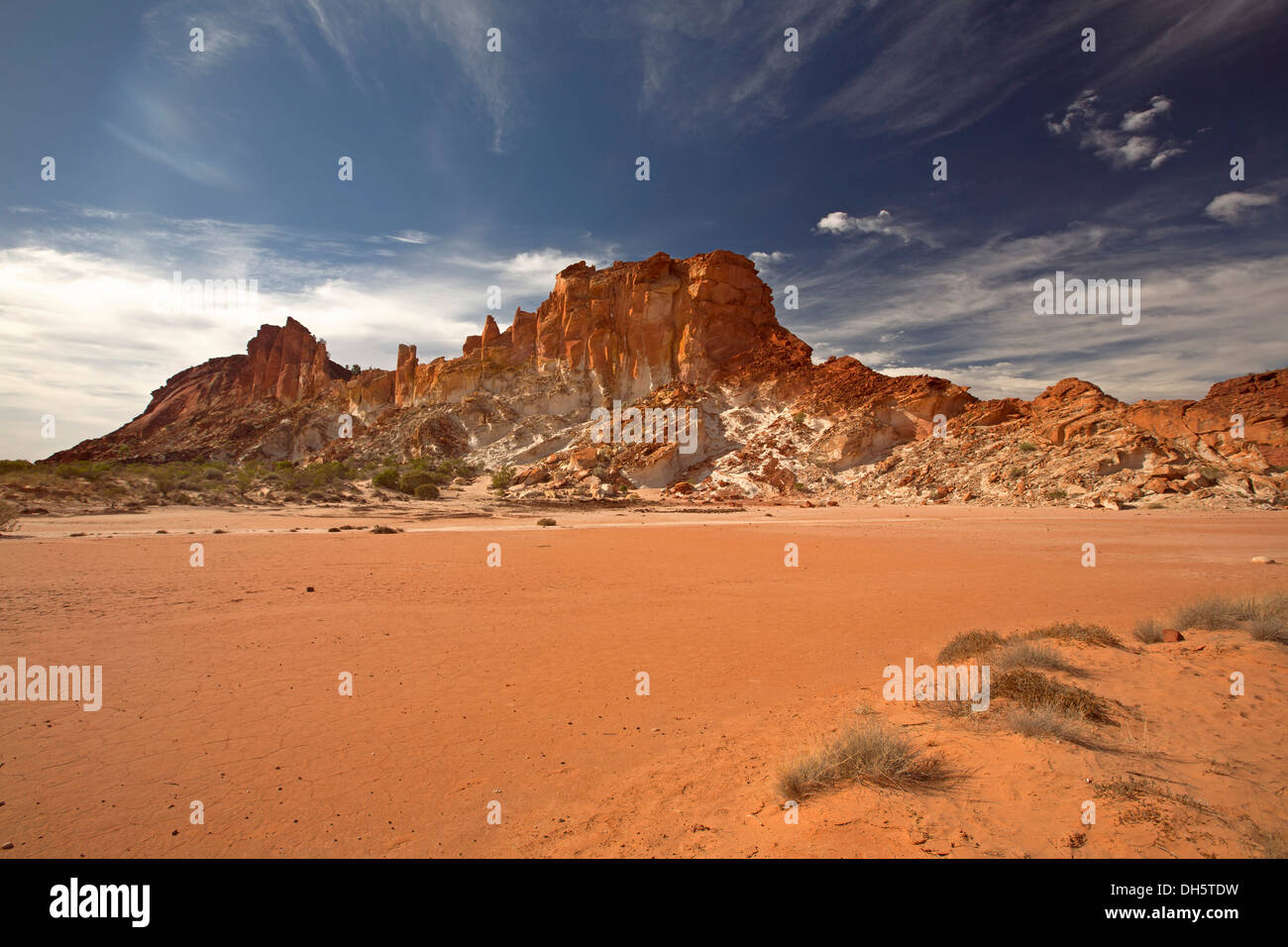 Outback / desert landscape with rocky outcrop and claypan at Rainbow Valley tourist attraction in central Australia NT Stock Photo