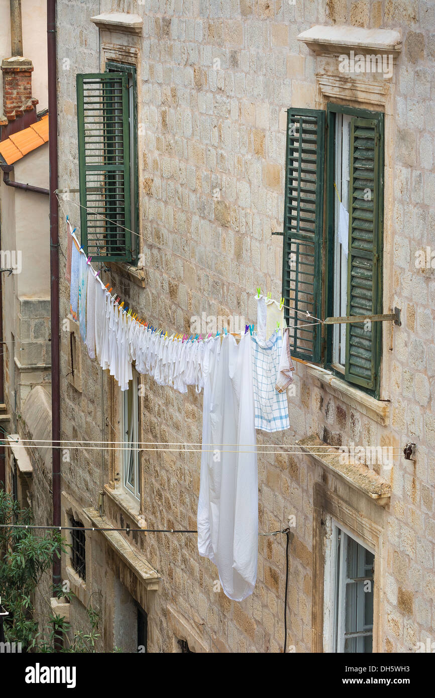 Laundry hanging from windows in Dubrovnik Stock Photo