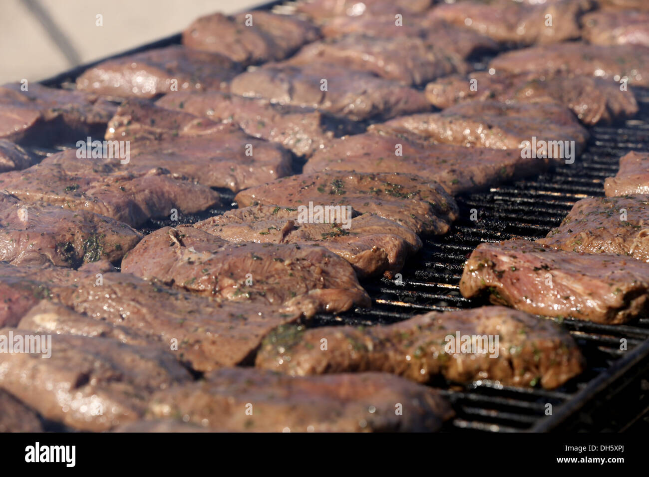 MARINE CORPS AIR STATION YUMA, Ariz. – Marines with 1st Battalion, 7th Marine Regiment, grill steaks for a warriors’ meal here, Stock Photo