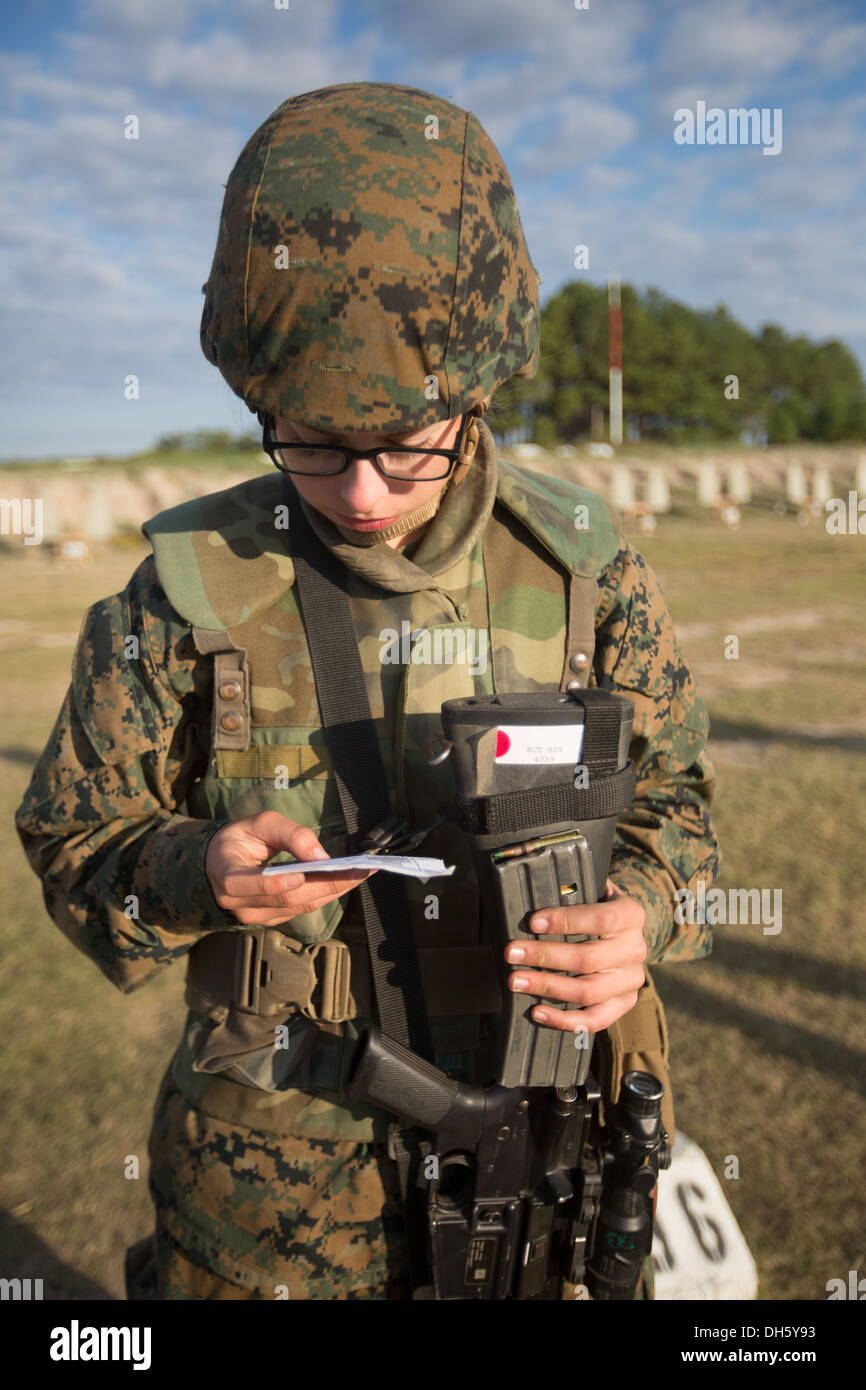 Rct. Chelsea Roy, Platoon 4039, November Company, 4th Recruit Training Battalion, reviews her study card before firing during th Stock Photo