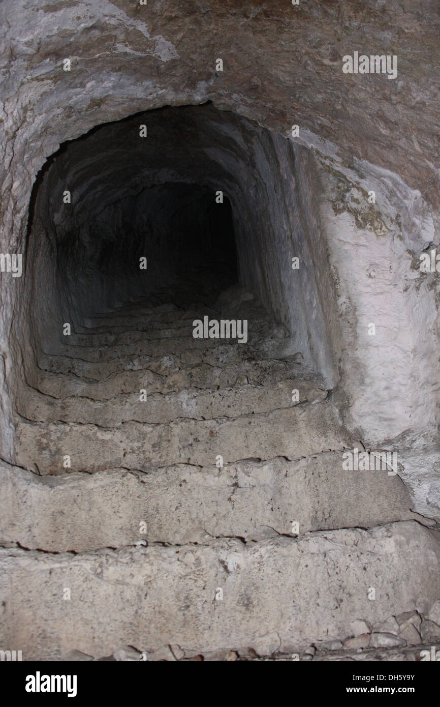 The tunnel leading through the rock to the hilltop fortress of Alara castle. Stock Photo