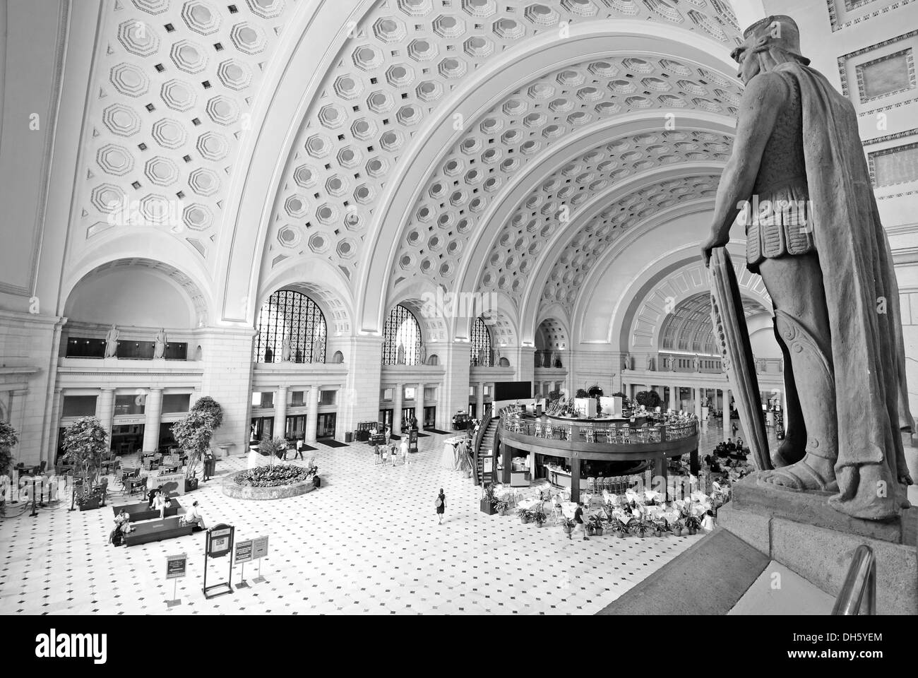 Black and white image, interior view, Great Main Hall, larger than life statues, station