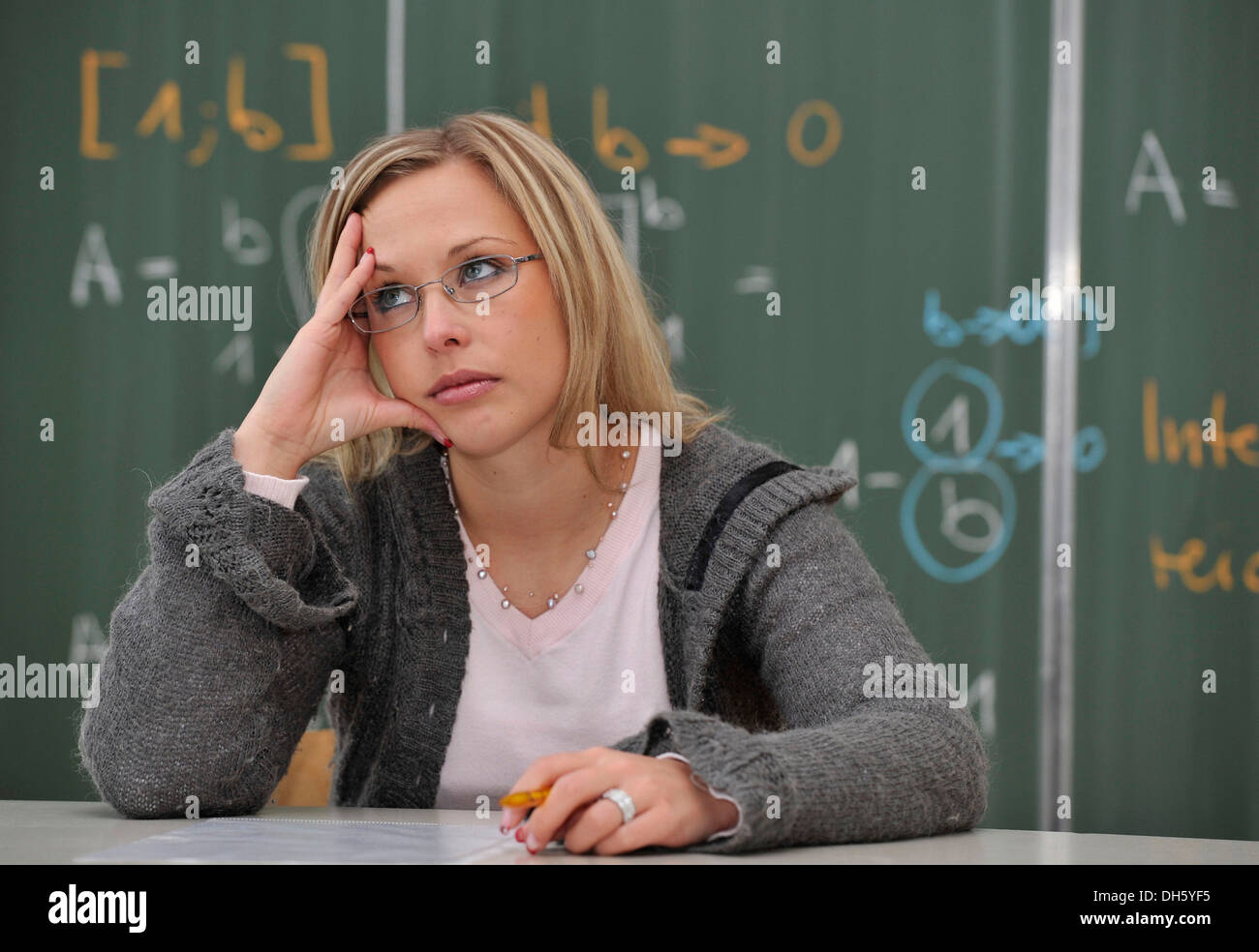 Burnout, excessive demand, test, trainee teacher, student, prospective teacher, young teacher, mathematics, blackboard Stock Photo