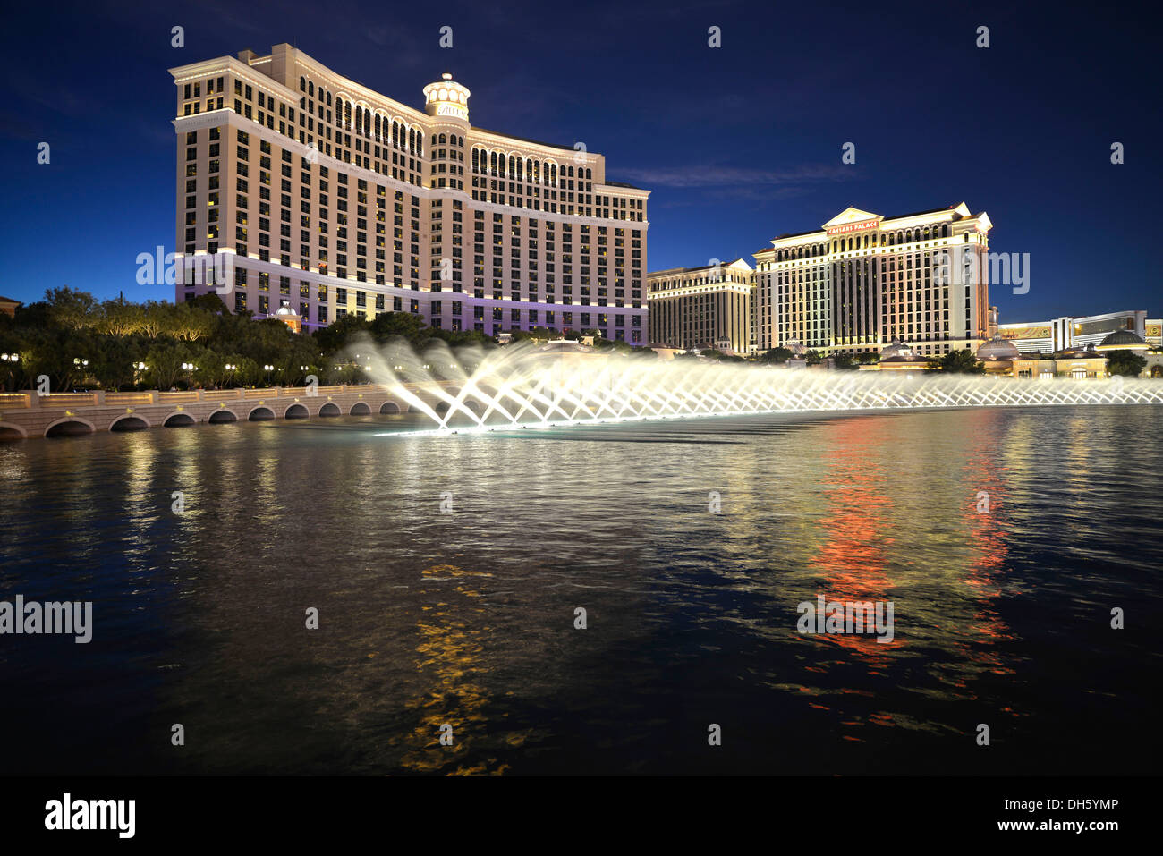 Night shot, trick fountains, Bellagio, Caesars Palace, The Mirage, luxury hotels and casinos, Las Vegas, Nevada, USA Stock Photo