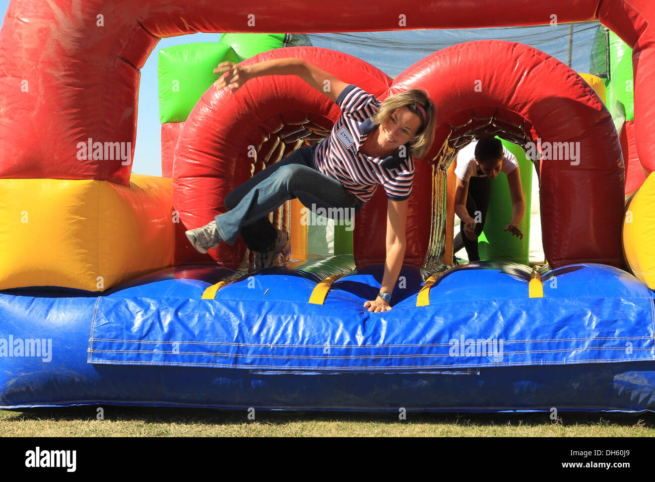 Spouses were challenged with completing an inflatable obstacle course during the Combat Center's CAX for Spouses event at Felix Stock Photo