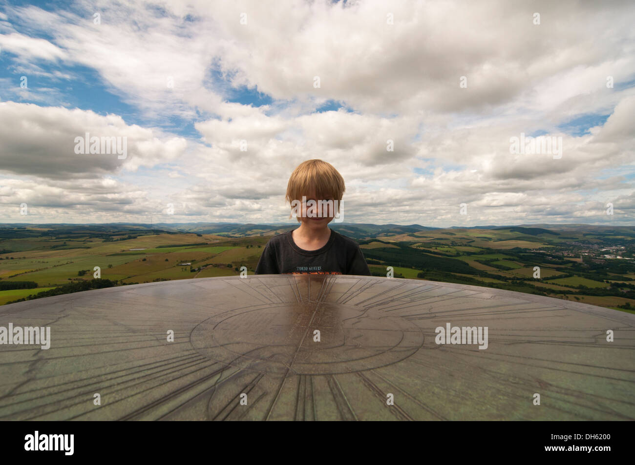 Boy and viewpoint marker on the middle Eildon, Melrose Stock Photo - Alamy