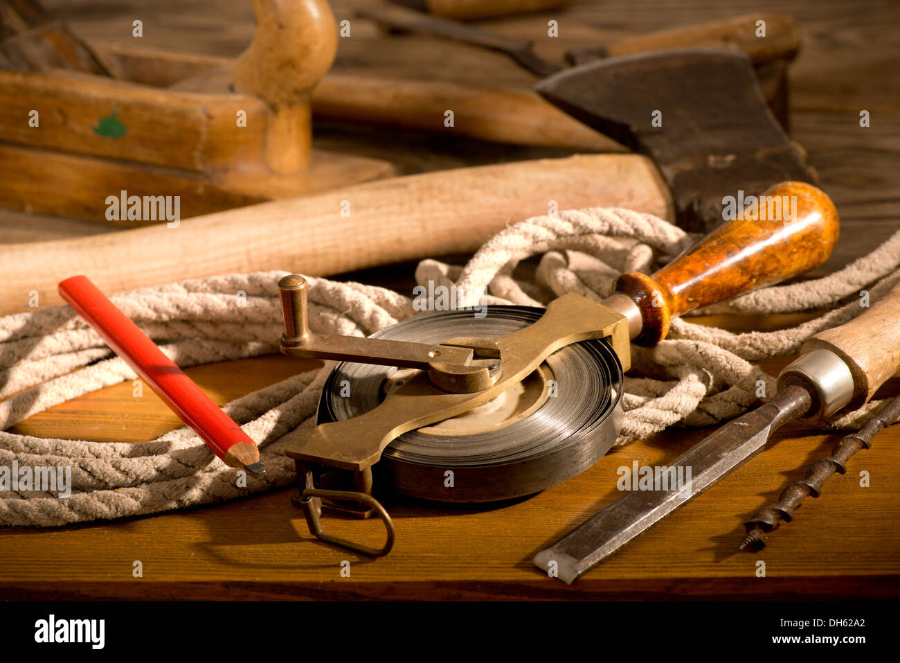 a tape measure with old tools in the workroom Stock Photo