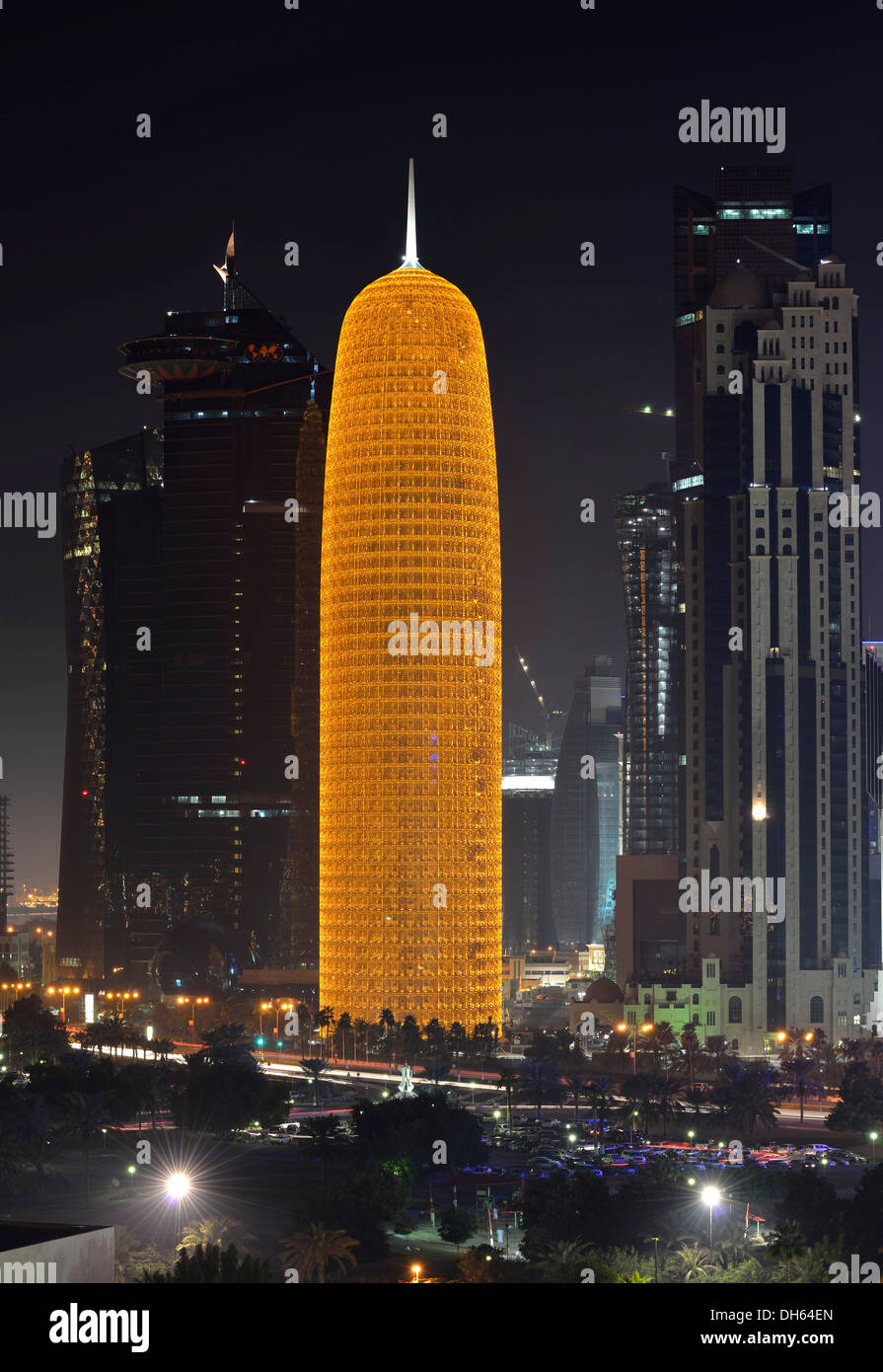 Night scene, skyline of Doha with Al Bidda Tower, World Trade Center, Palm Tower 1 and 2, Burj Qatar Tower with golden Stock Photo