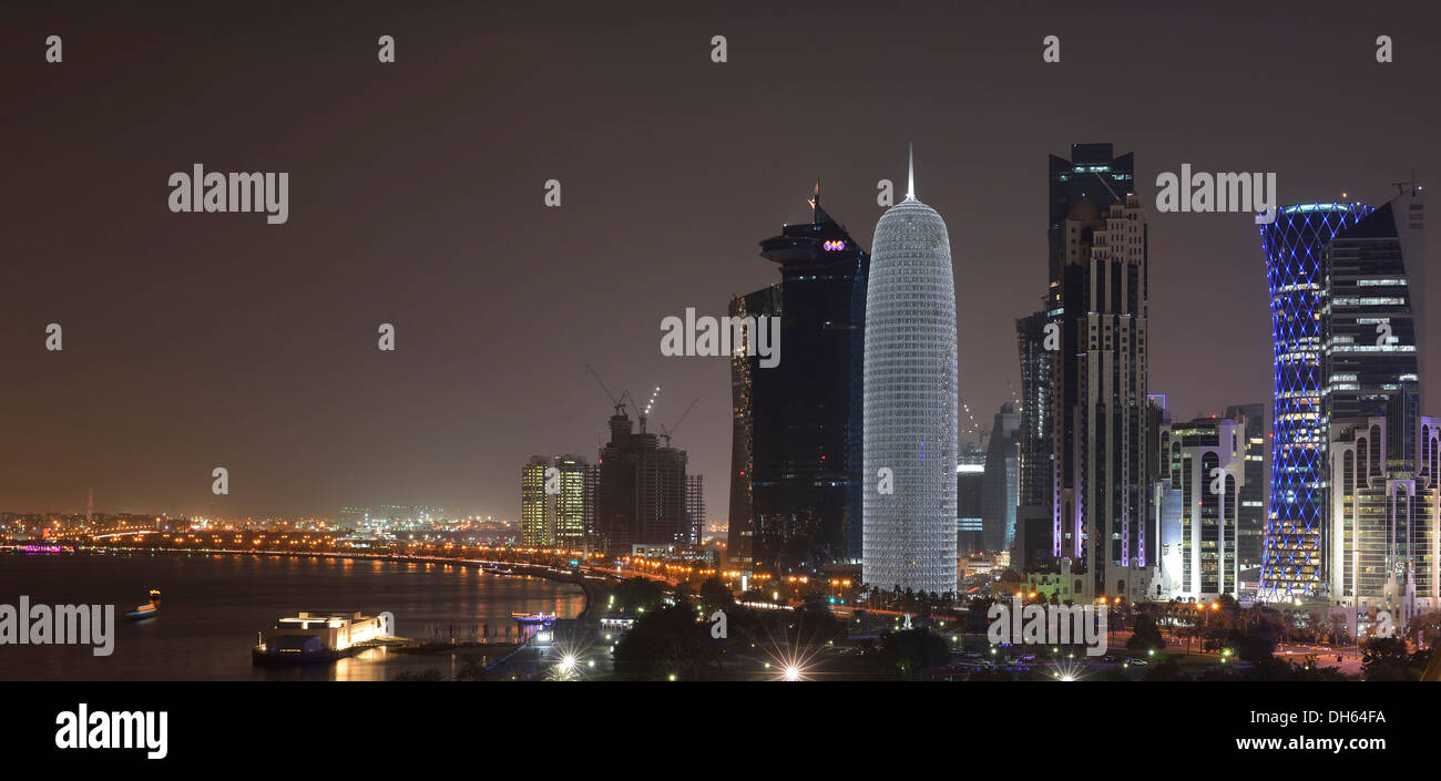 Night scene, Corniche waterfront promenade and skyline of Doha with Al ...