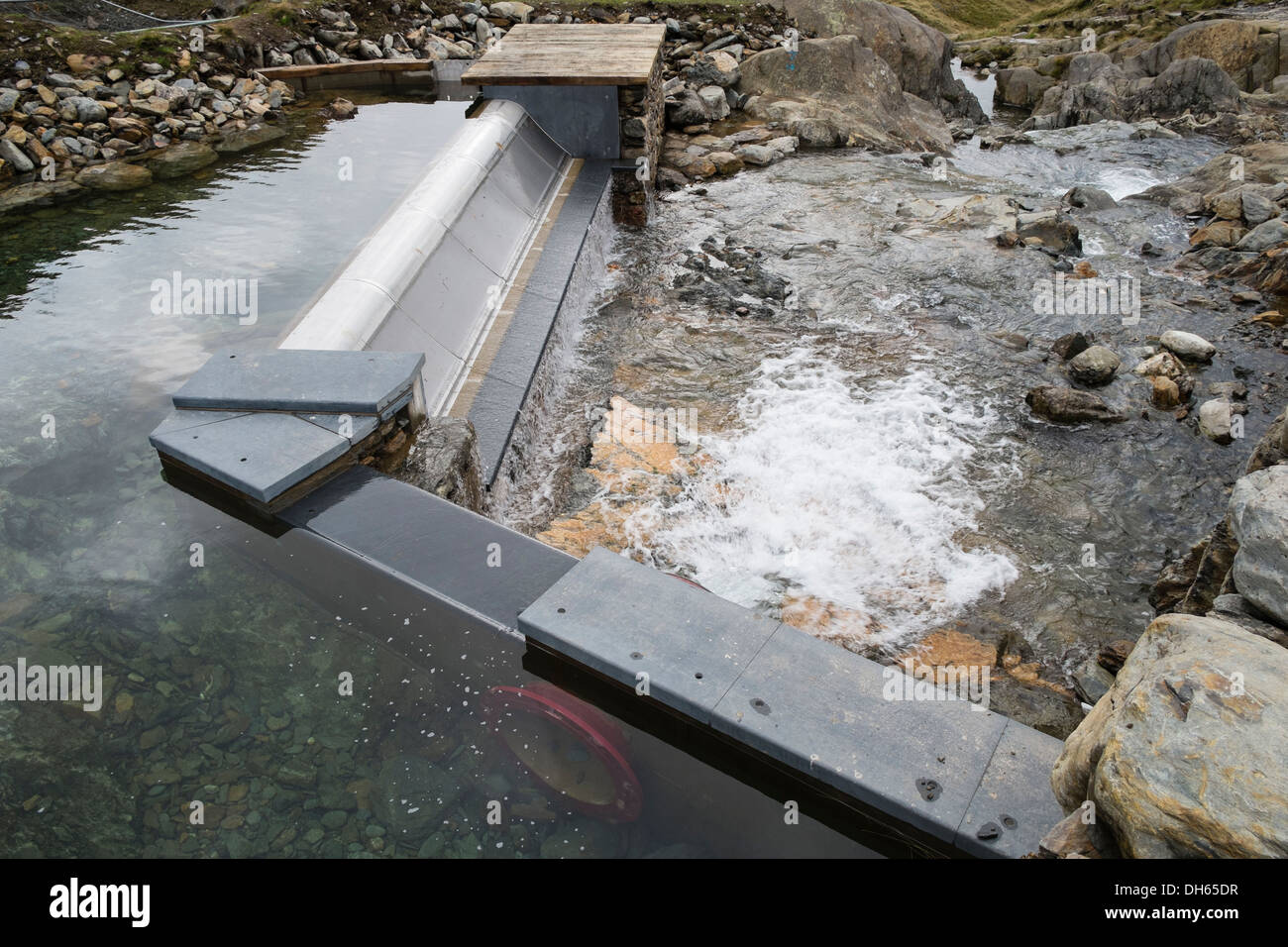 Weir on Afon Llan river in Snowdonia gathers water for National Trust's small hydro-electric scheme. Cwm Llan Gwynedd Wales UK Stock Photo