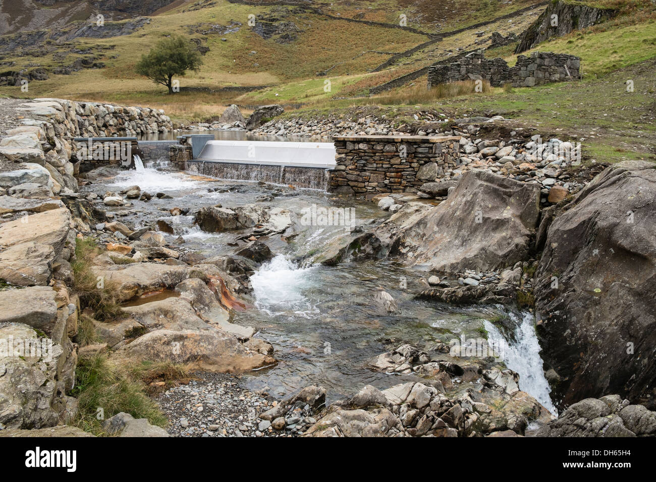 Weir on Afon Llan river in Snowdonia gathers water for small hydro-electric power plant scheme. Cwm Llan Gwynedd Wales UK Britain Stock Photo