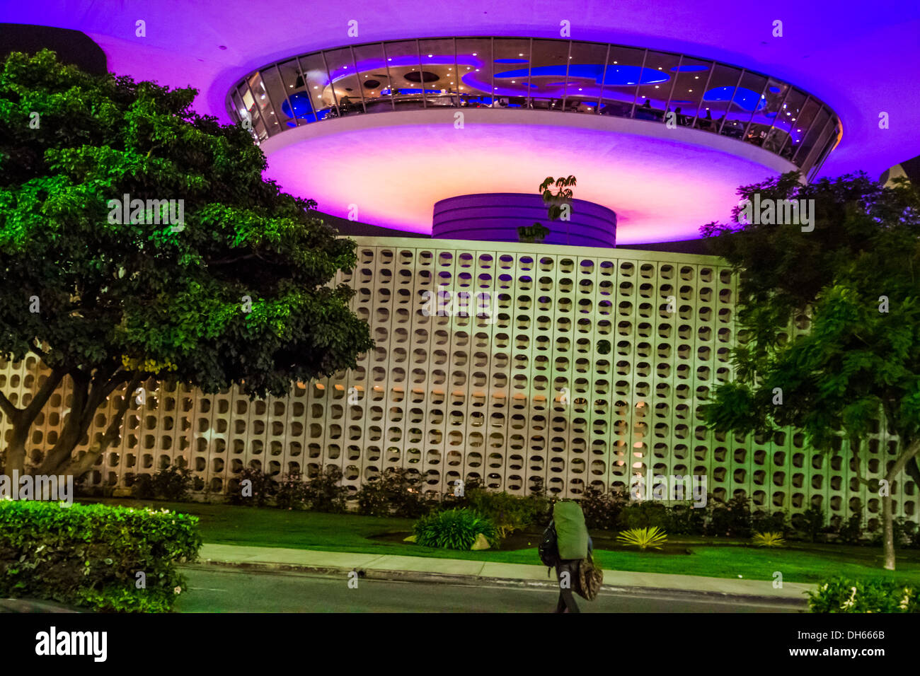 A lone serviceman leaving the Bob Hope USO club at Los Angeles International Aiport with the Encounter Restaurant in  background Stock Photo