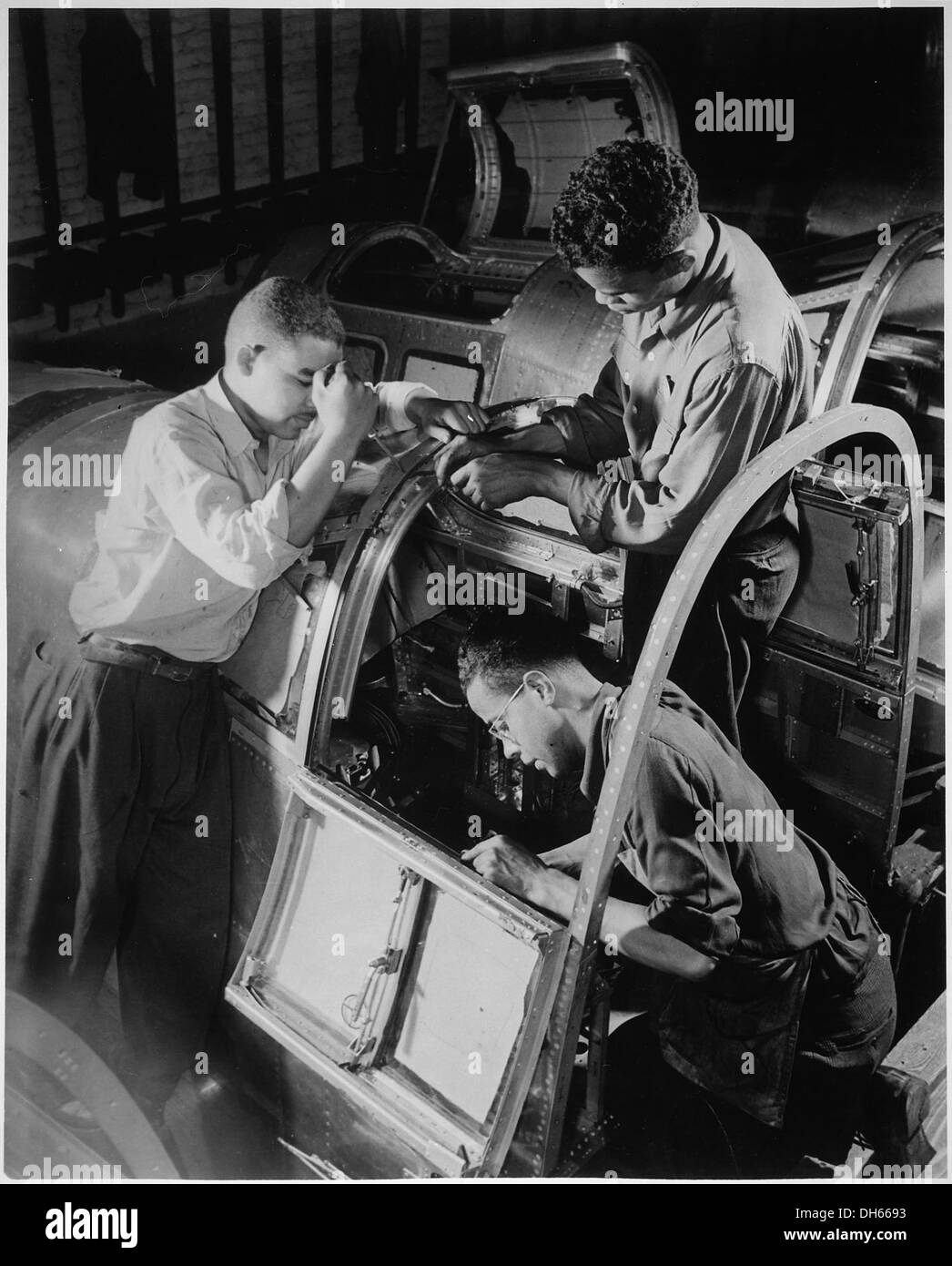 Final assembly of the pilot's compartment is being made by these Negro