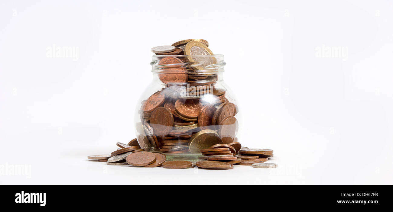 jar full of coins Stock Photo