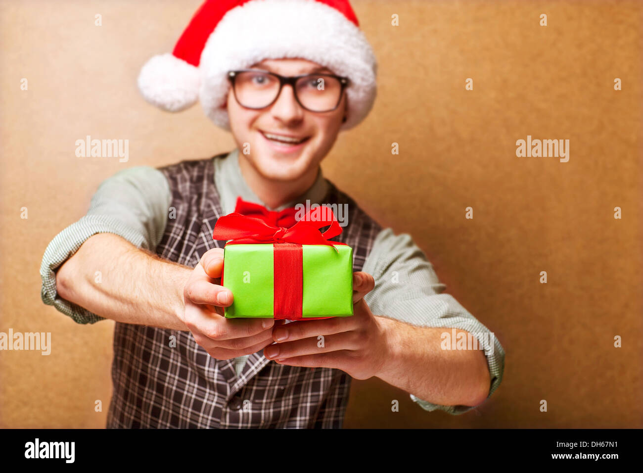 bright picture of handsome man holding gift boxes Stock Photo