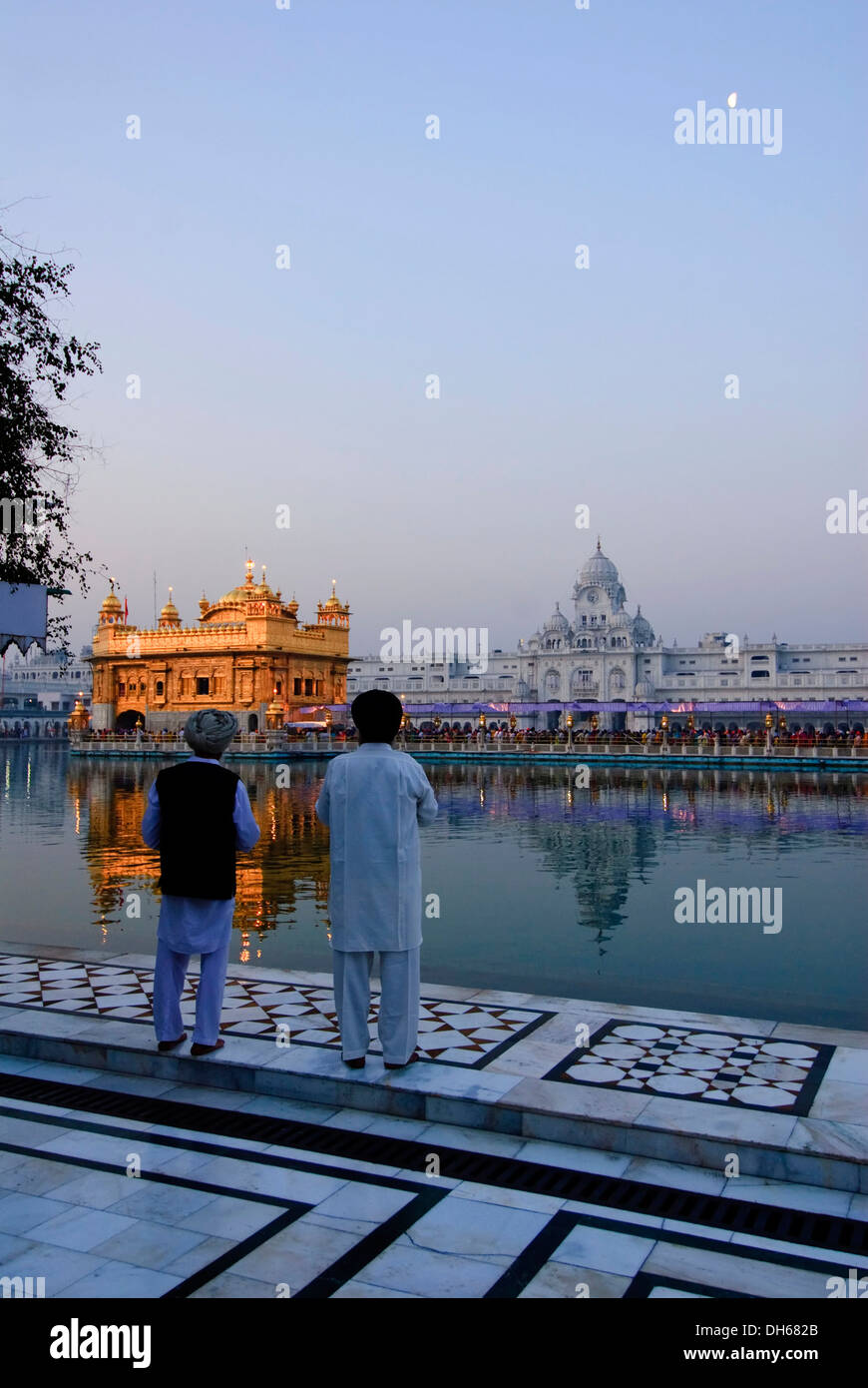 Sikhs looking at the Golden Temple, Amritsar, India, Asia Stock Photo