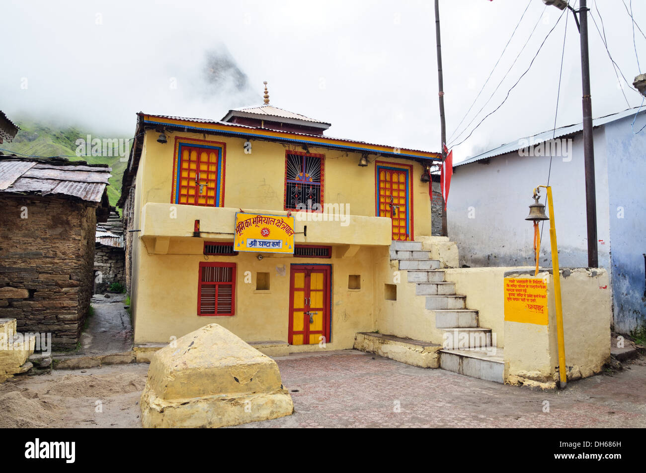 Bright yellow house in Mana village, India Stock Photo