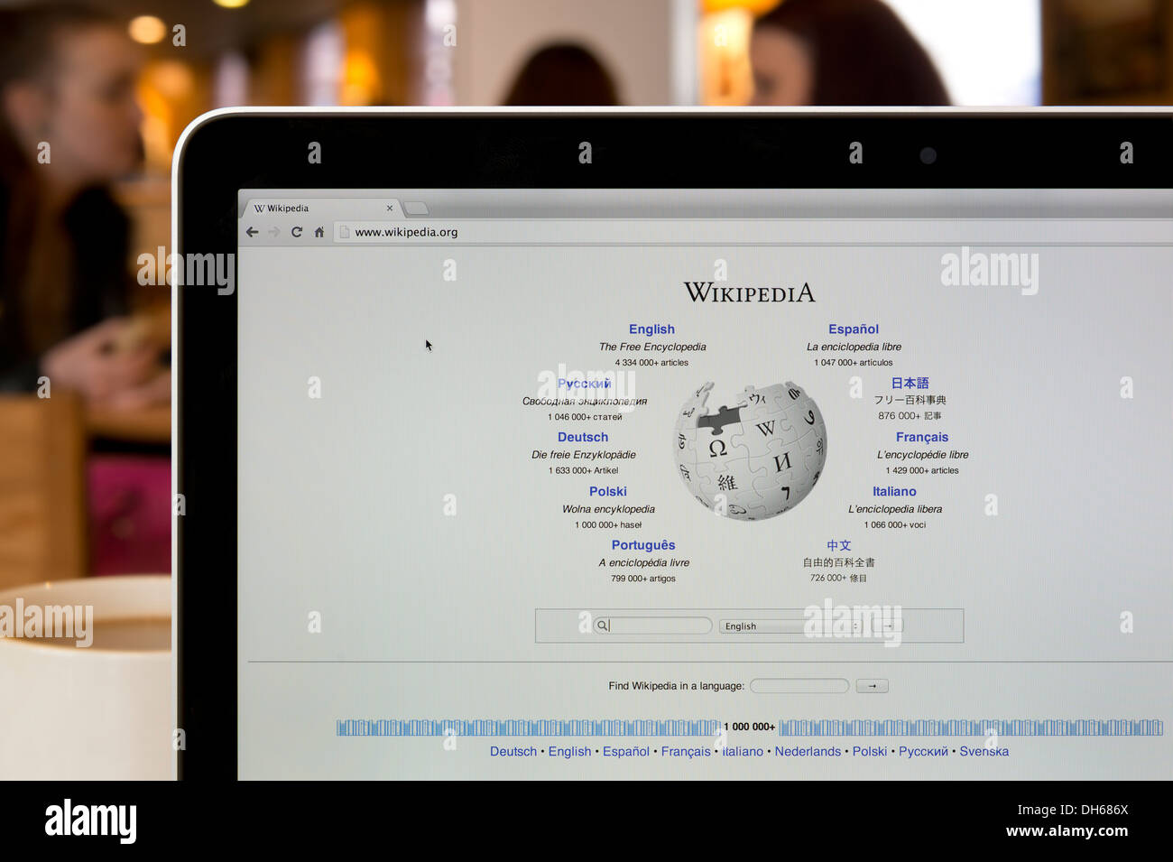 The Wikipedia website shot in a coffee shop environment (Editorial use only: print, TV, e-book and editorial website). Stock Photo