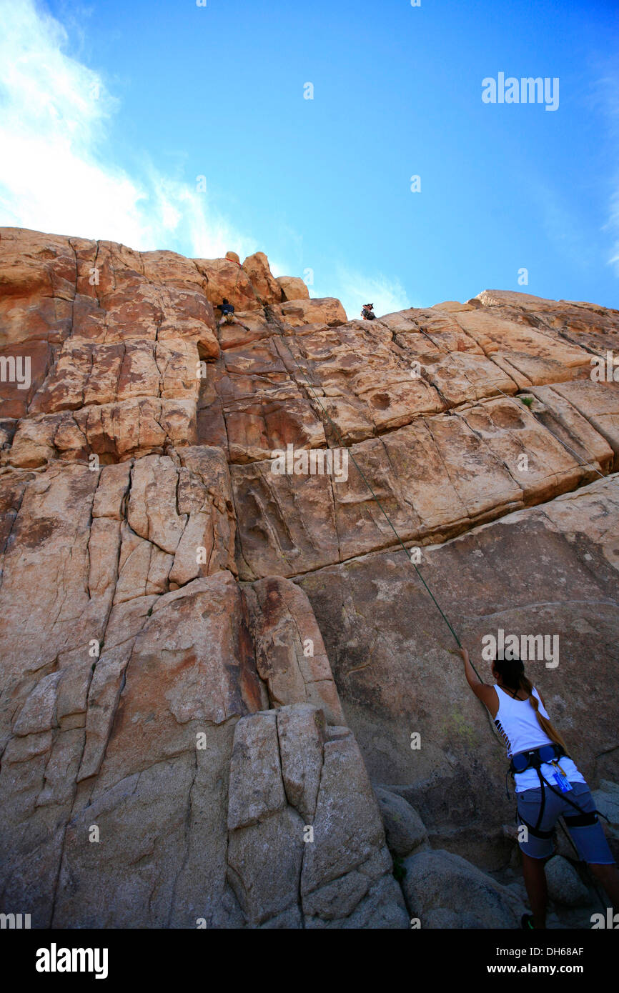 Climber climbing the Thin Wall climbing route in Joshua Tree National