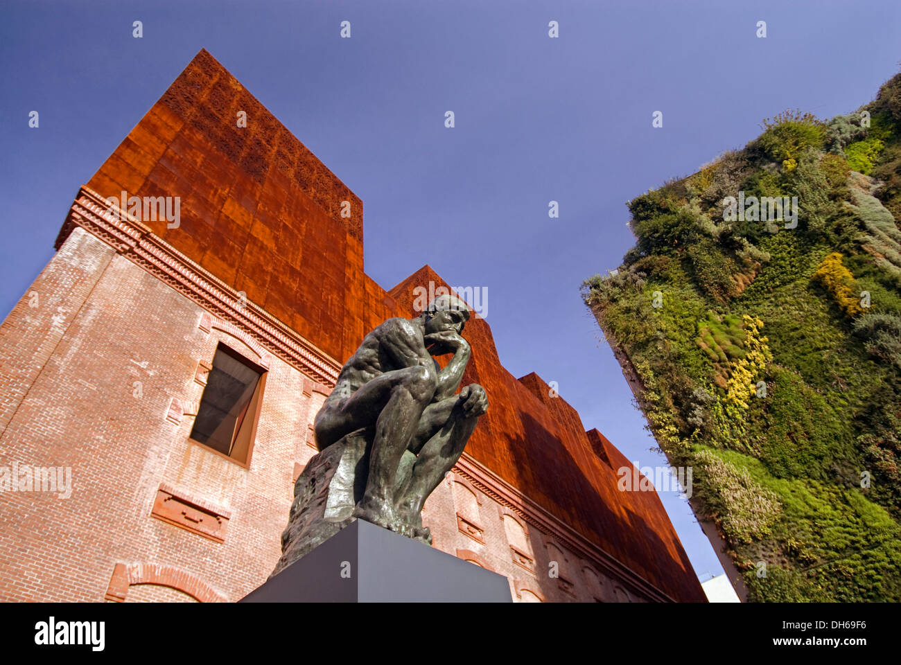 Rodin's sculpture 'The Thinker' in front of the Caixa Forum Museum Art Center, Madrid, Spain, Europe Stock Photo