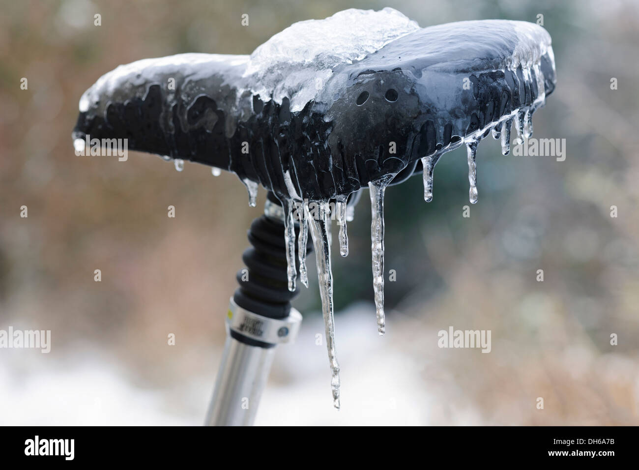 Icicles on a bicycle saddle after freezing rain, Emmendingen, Baden-Württemberg, Germany Stock Photo