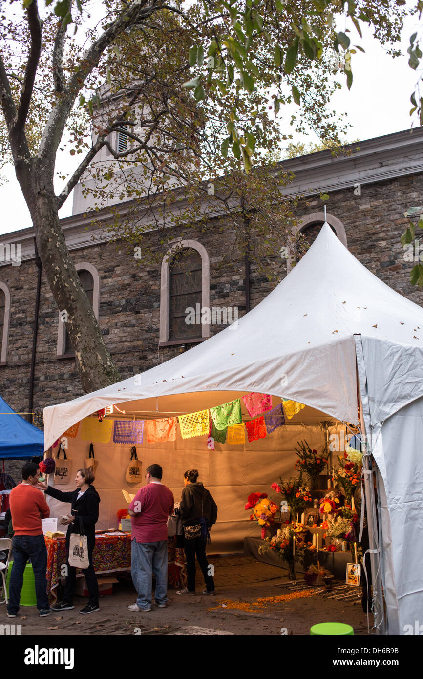 New York, NY, 31 October 2013. A tent with a public altar stands in the churchyard of St. Mark's Church in-the-Bowery. Mano a Mano, a New York City Mexican cultural organization, organized the altar and event. Credit:  Ed Lefkowicz/Alamy Live News Stock Photo