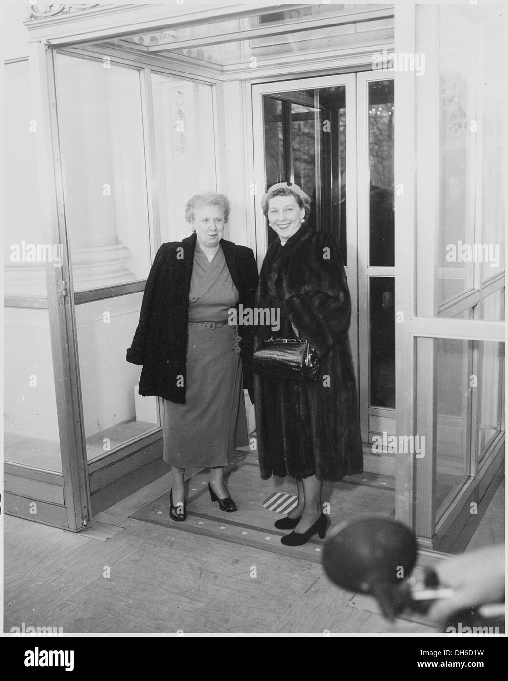 Photograph of First Lady Bess Truman with Mamie Eisenhower, wife of the President-elect, during Mrs. Eisenhower's... 200403 Stock Photo