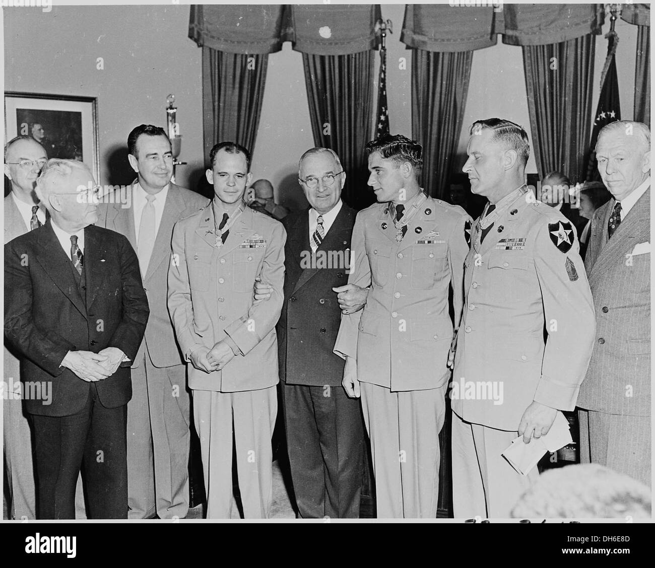 Photograph of President Truman in the Oval Office after presenting three Korean War veterans with the Medal of Honor... 200295 Stock Photo