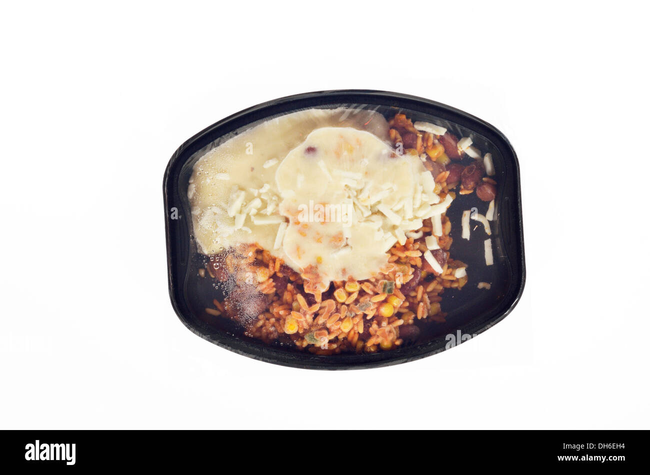 Frozen ready meal of red beans, rice and cheeses before microwaving on white background, cutout. Stock Photo