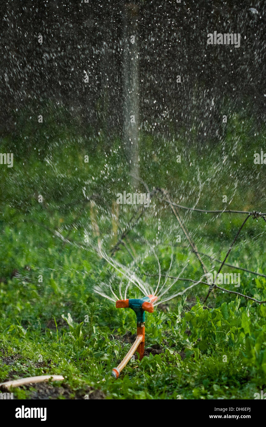 Rotating irrigation system throwing water drops away Stock Photo Alamy