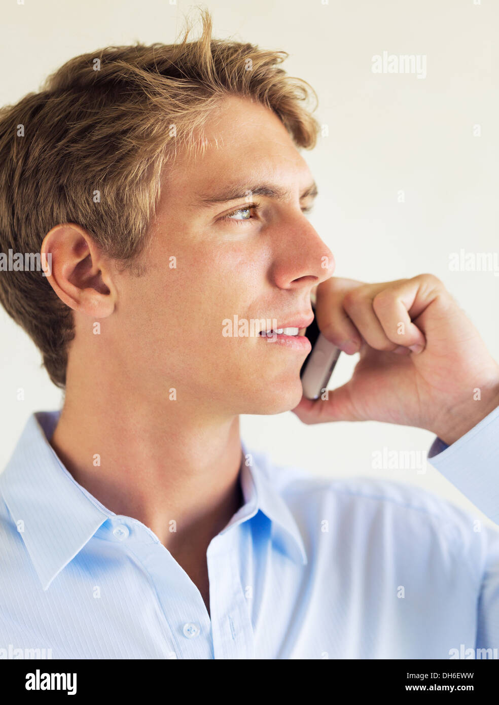 Young Professional, Handsome Man Using Smart Mobile Phone Stock Photo