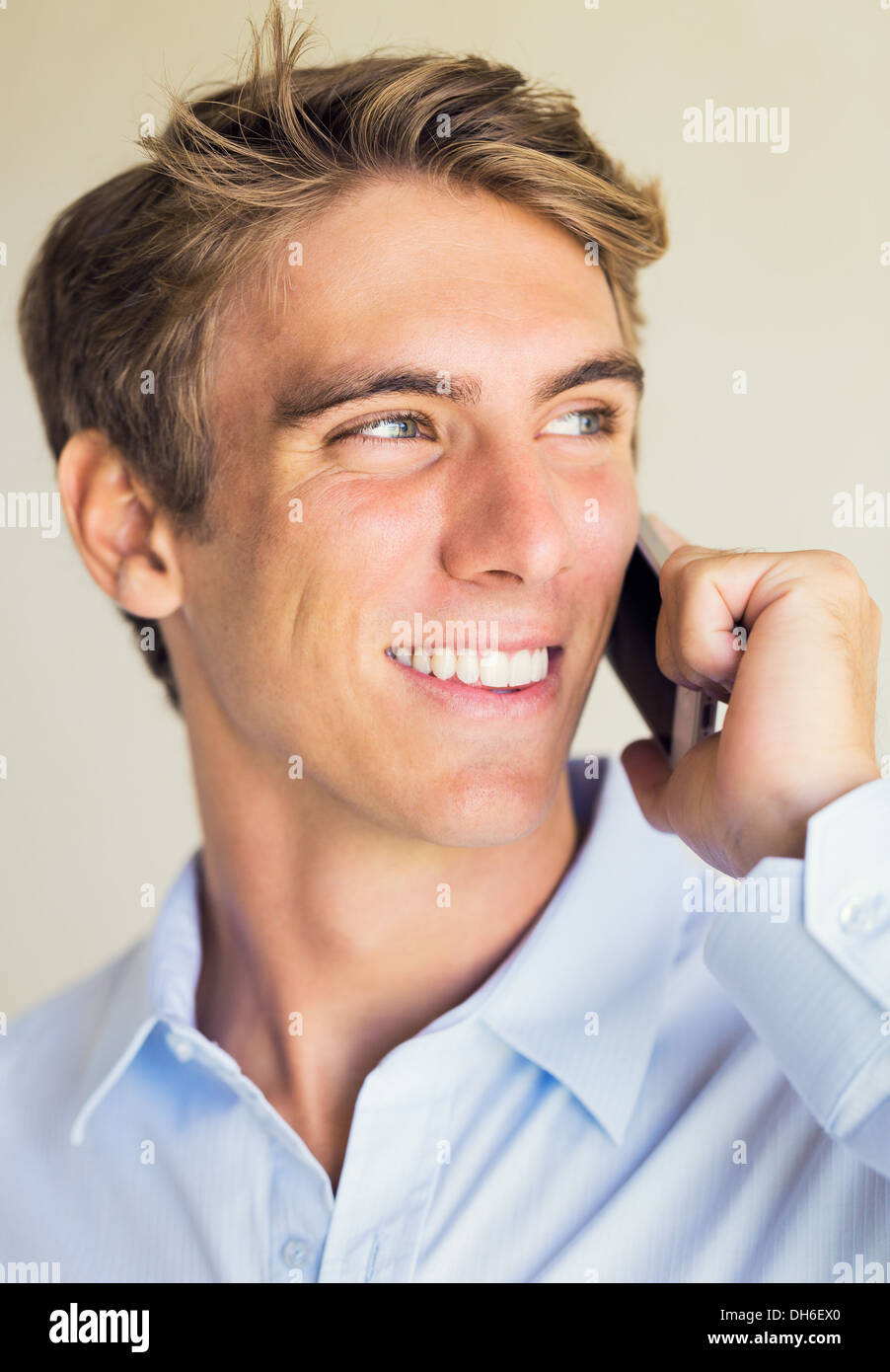 Young Professional, Handsome Man Using Smart Mobile Phone Stock Photo